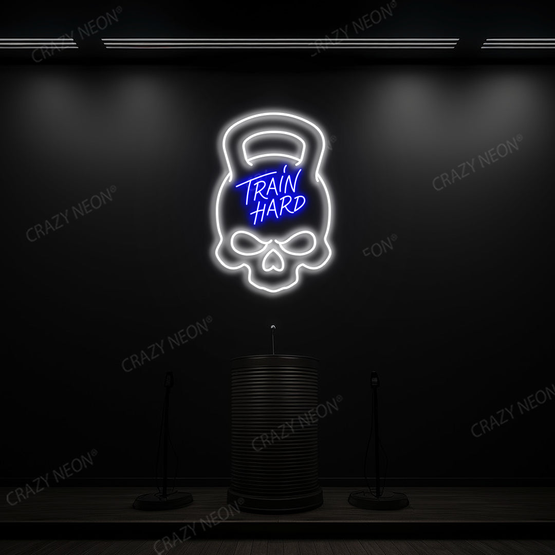 blue and white train hard kettlebell neon sign mounted on a wall