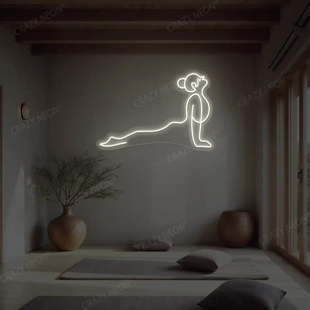 Urdhva Mukha Svanasana Yoga Neon Sign lighting up in white color in a yoga room