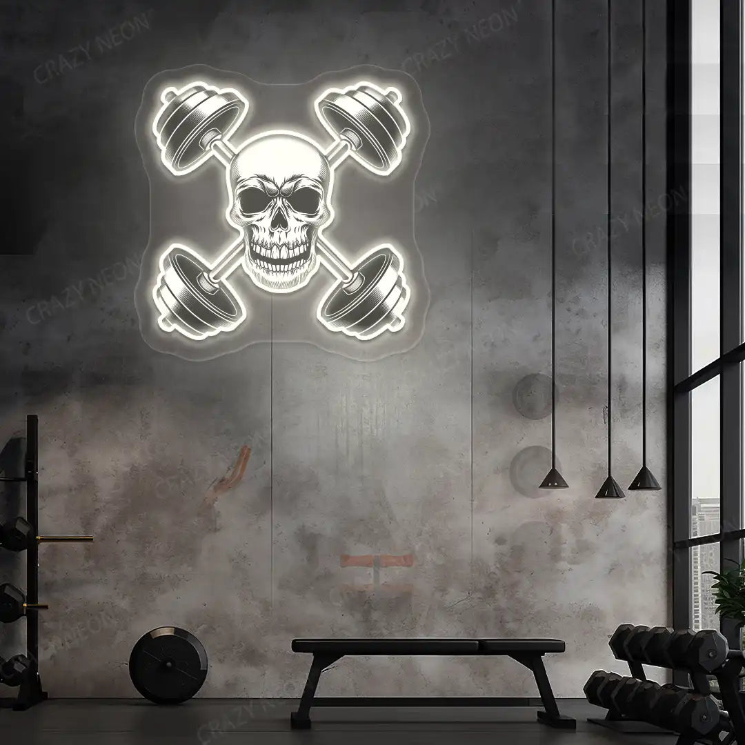 warm white skull cross dumbbell gym neon artwork mounted on a wall