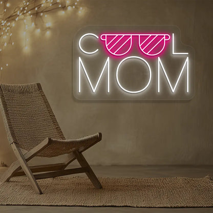 pink and white cool mom trendsetter neon sign mounted on a wall