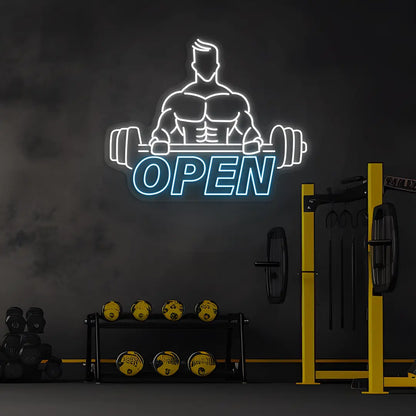 ice blue and white open gym bodybuilder neon sign mounted on a wall