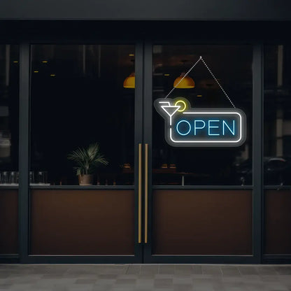 ice blue martini open neon sign hanging on a window