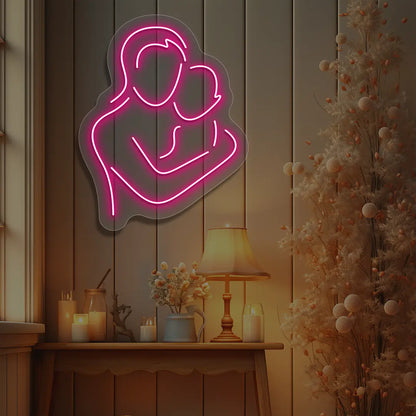 pink mamas hug neon sign mounted on a wall