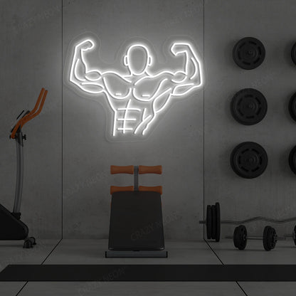white flexing bodybuilder gym neon sign mounted on a wall