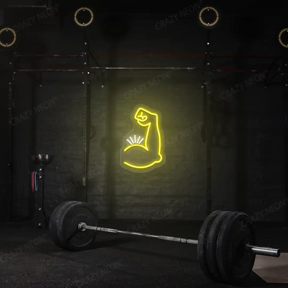 yellow and white bicep pump neon sign mounted on a wall