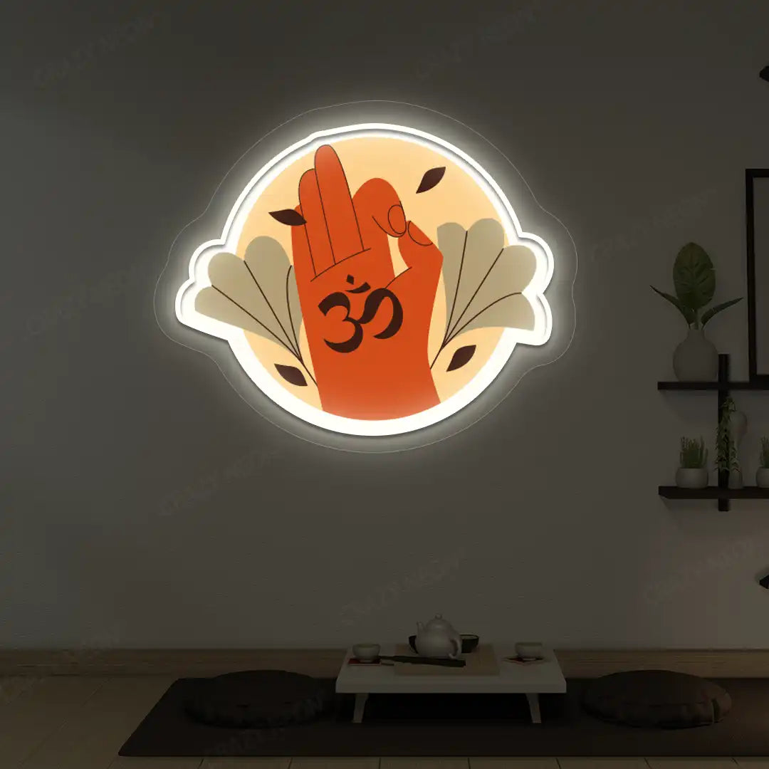 Om Gyan Mudra Neon Artwork lighting up in warm white color in a yoga room