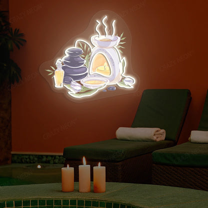 Spa Stones & Aromatherapy Neon Artwork lighting up in warm white color on a spa wall