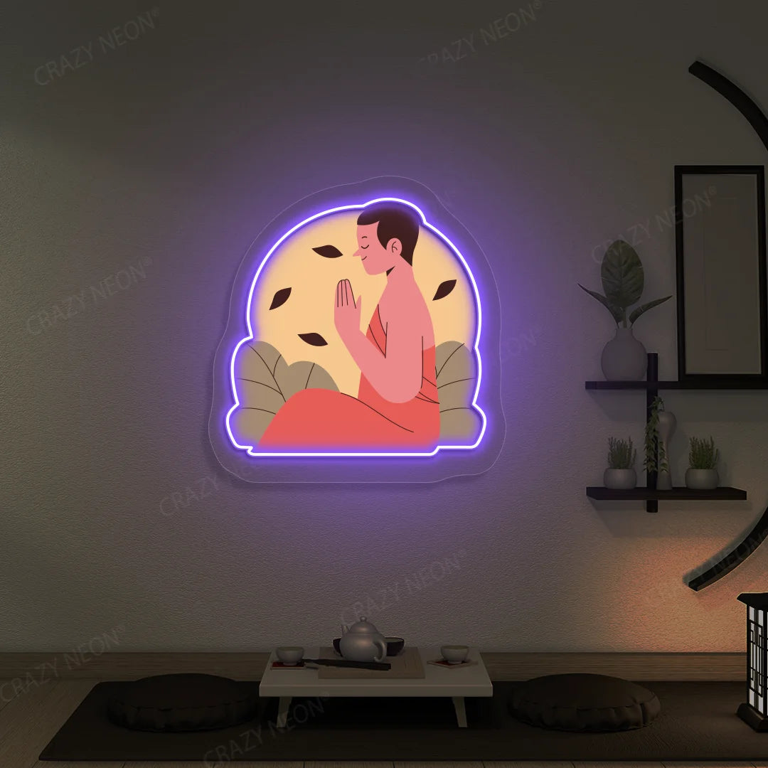 Serene Monk Neon Artwork lighting up in purple color in a yoga room