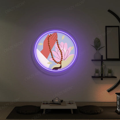 Lotus Japa Neon Artwork lighting up in purple color in a yoga room