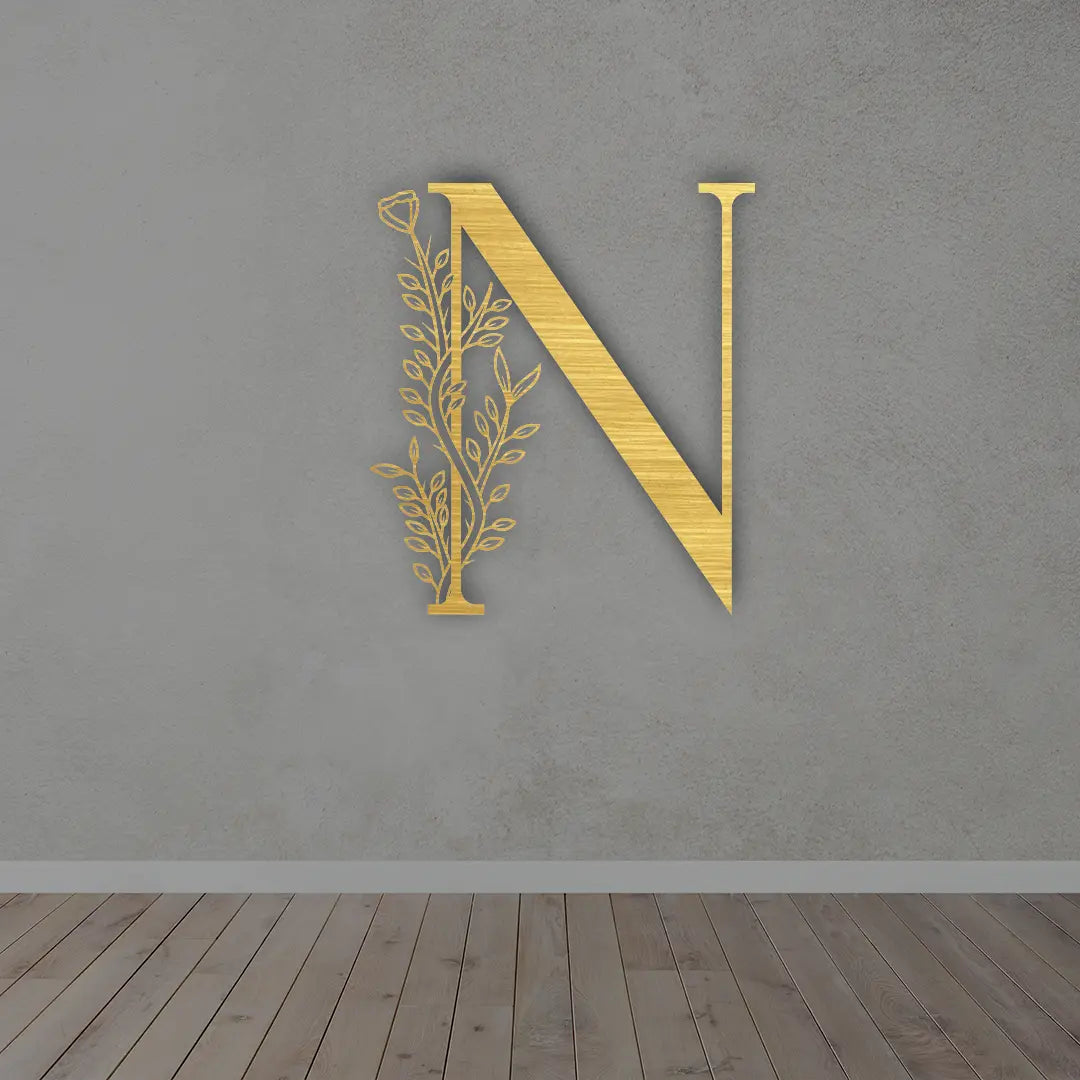 Metal Initial Sign in Golden colour mounted on wall 