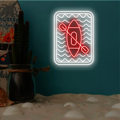red and white kayak ocean waves neon sign mounted on a wall