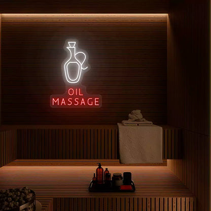 Oil Massage neon sign in white and red colors glowing on a wooden wall