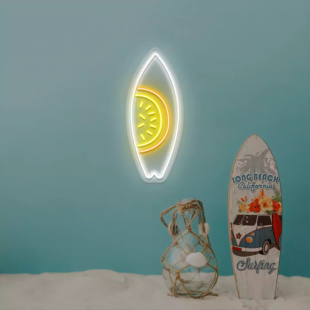 yellow orange and white watermelon surfboard neon sign mounted on a wall