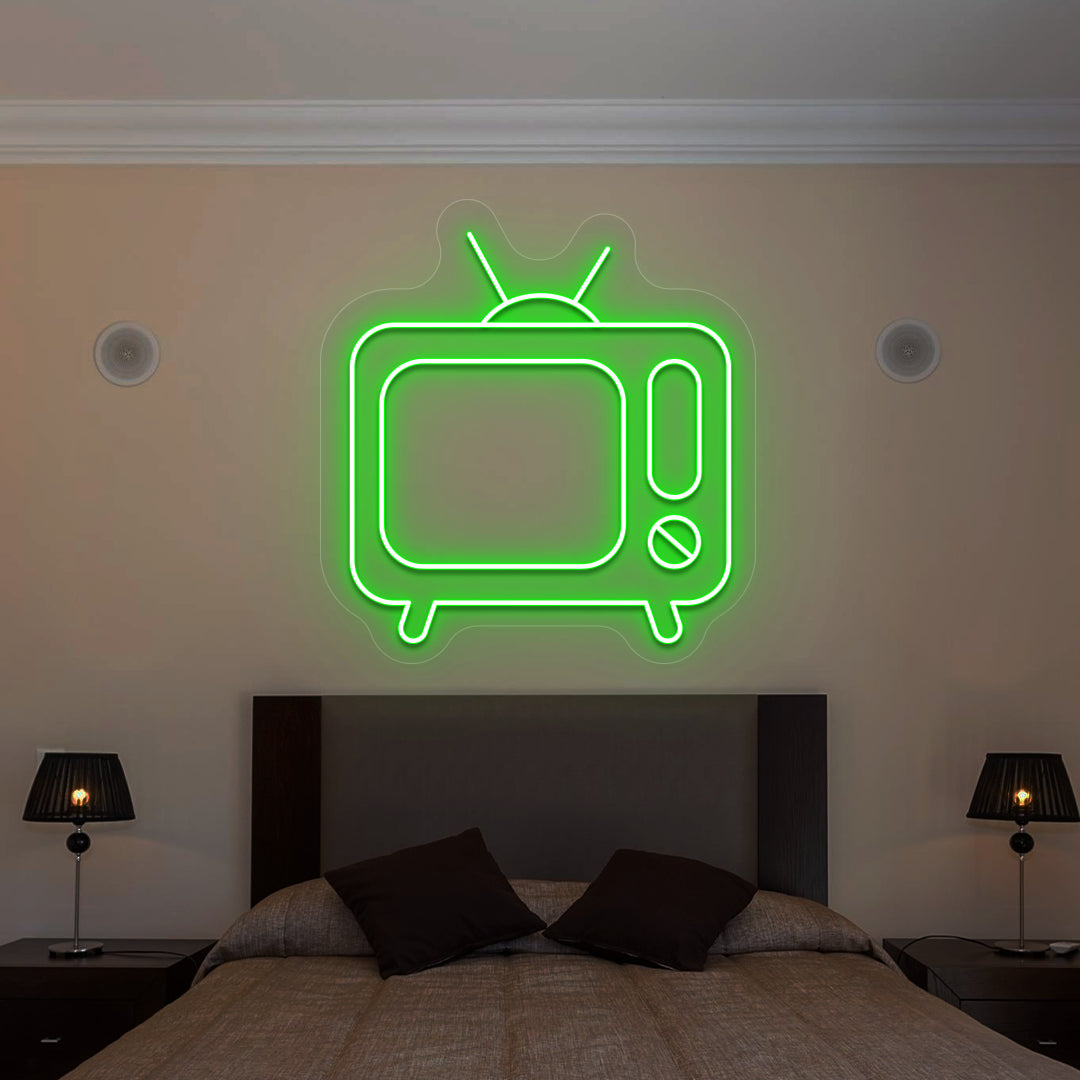 green retro tv vintage neon sign mounted on a wall