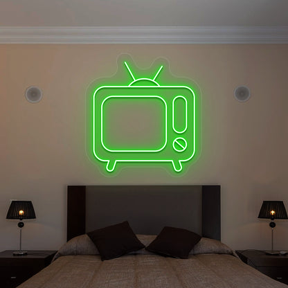 green retro tv vintage neon sign mounted on a wall