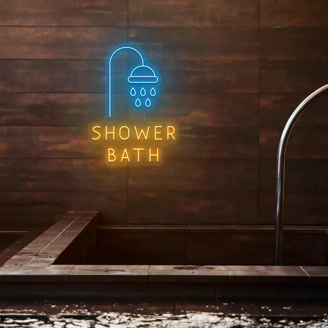 Shower Bath neon sign in ice blue and orange colors glowing on a wooden wall