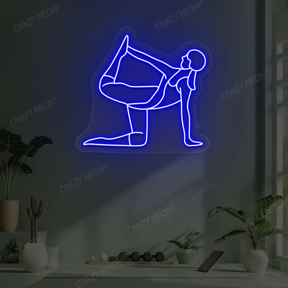 Ardha Dhanurasana Yoga Neon Sign glowing in blue color in a yoga room