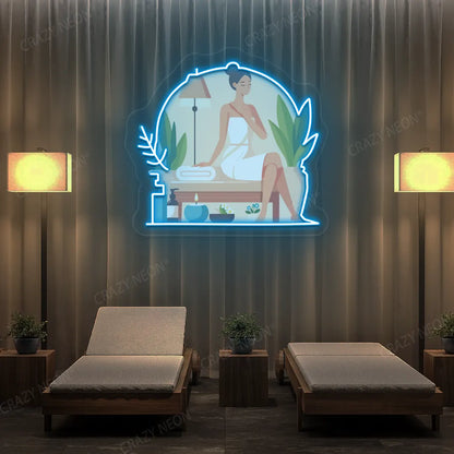 Spa Lounge Neon Artwork lighting up in ice blue color in a spa room