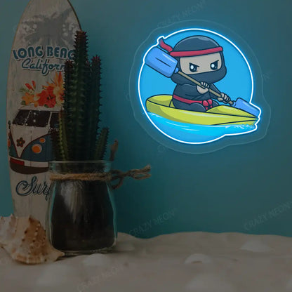 ice blue ninja kayaking neon artwork mounted on a wall
