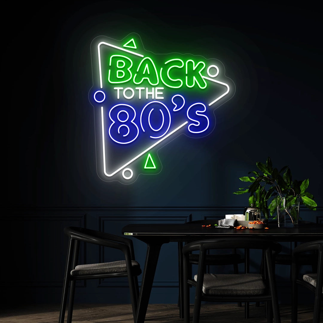 green blue and white back to the 80s vintage neon sign mounted on a wall