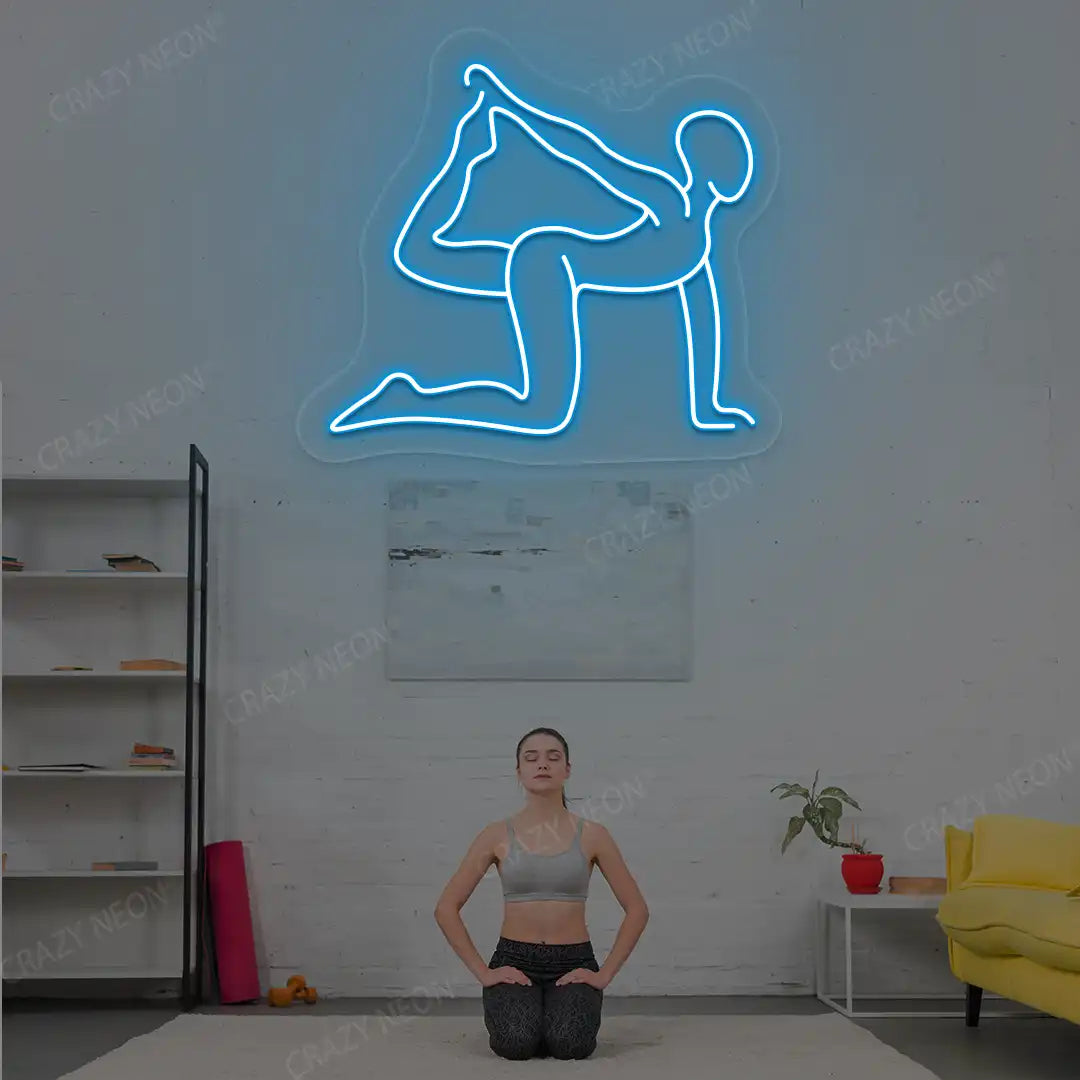 Eka Hasta Vyaghrasana Yoga Neon Sign glowing in iceblue color in a yoga room