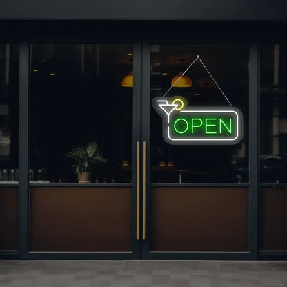 green martini open neon sign hanging on a window
