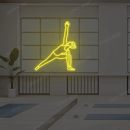 Utthita Parsvakonasana Yoga Neon Sign lighting up in yellow color in a yoga room