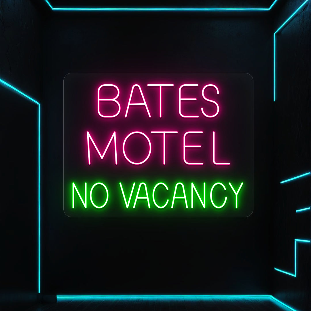 pink and green bates motel no vacancy vintage neon sign mounted on a wall