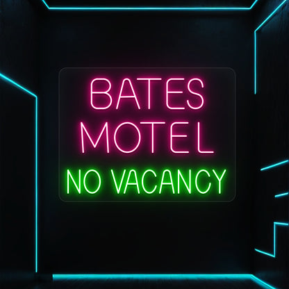 pink and green bates motel no vacancy vintage neon sign mounted on a wall