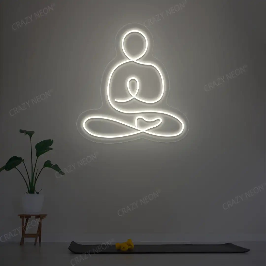 Swastikasana Yoga Neon Sign lighting up in warm white color in a yoga room