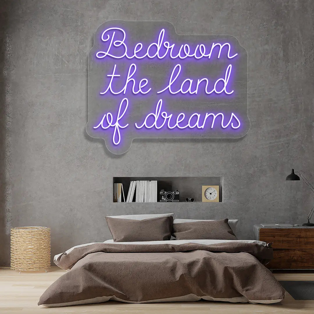 purple bedroom the land of dreams neon sign mounted on a wall