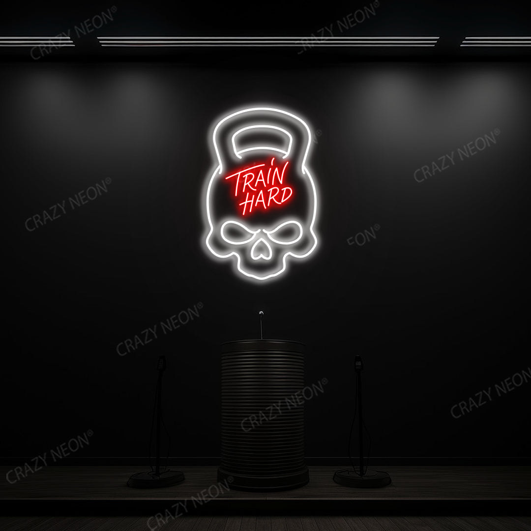 red and white train hard kettlebell neon sign mounted on a wall