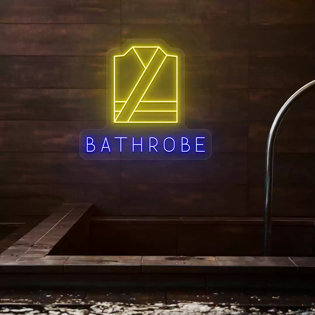 Golden Bathrobe neon sign in yellow and blue colors glowing on a wooden wall