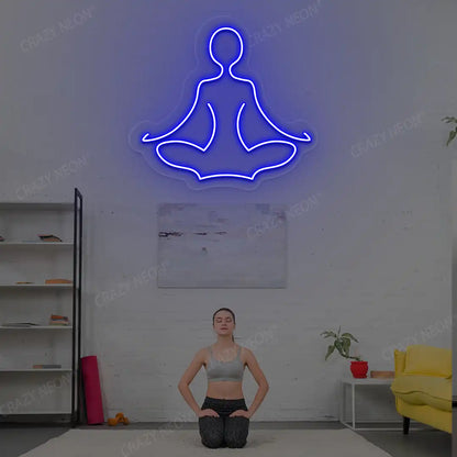 Sukhasana Yoga Neon Sign lighting up in blue color in a yoga room