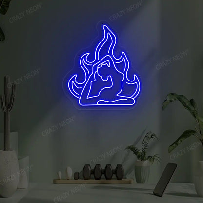 Flamed Eka Pada Rajakapotasana Yoga Neon Sign lighting up in blue color in a yoga room