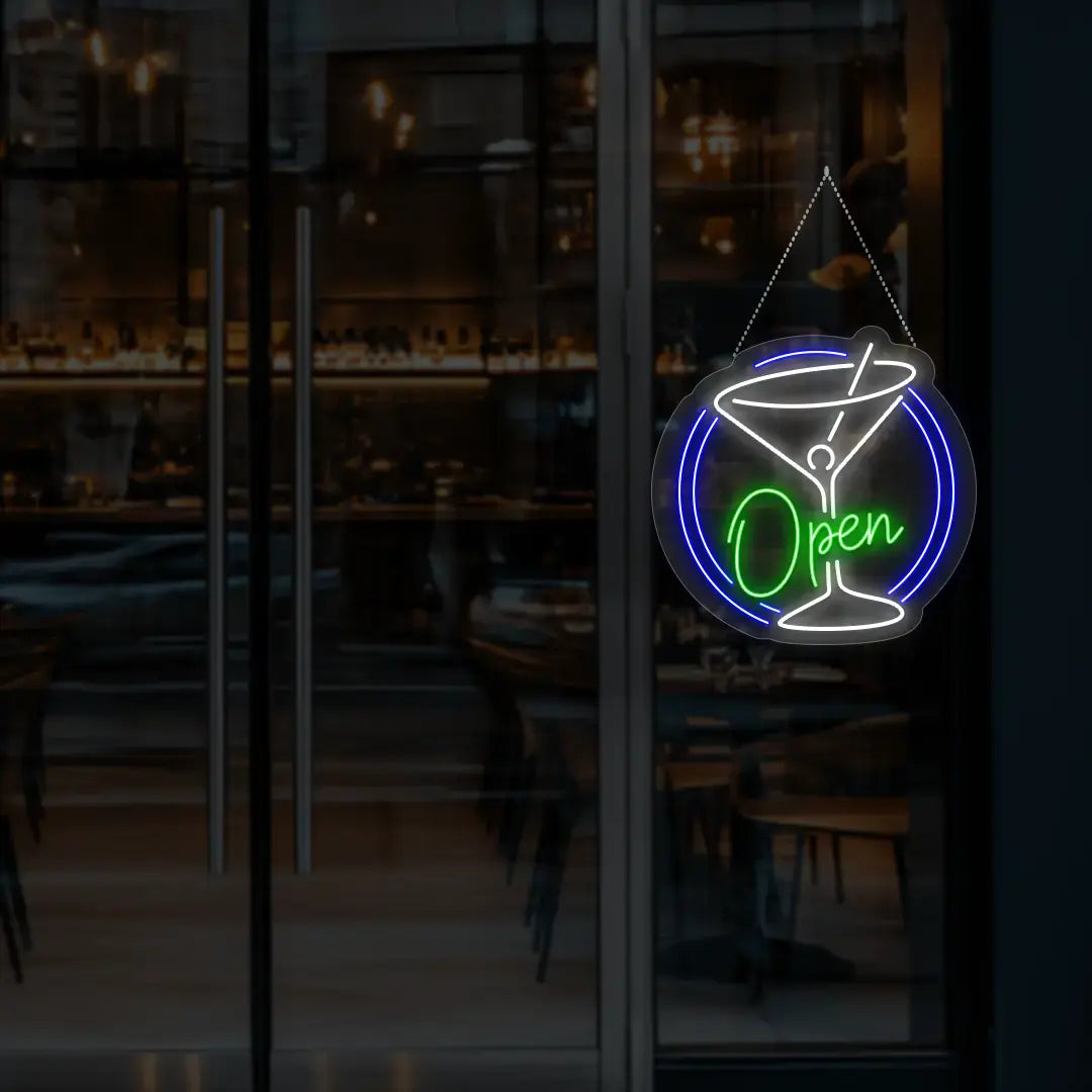 green cocktail open neon sign hanging on a window