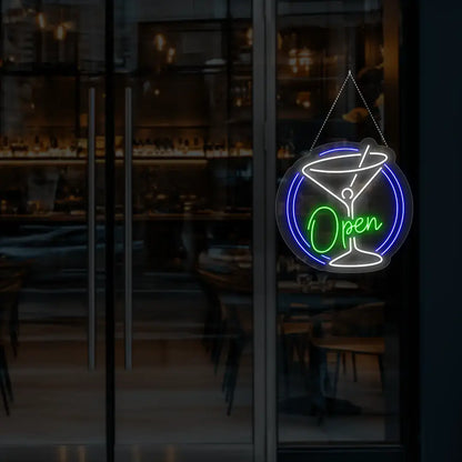 green cocktail open neon sign hanging on a window