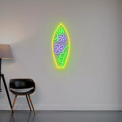 purple green and yellow flower surfboard neon sign mounted on a wall