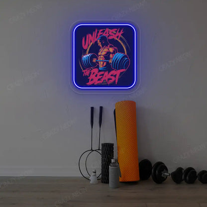 blue unleash the beast gym neon artwork mounted on a wall