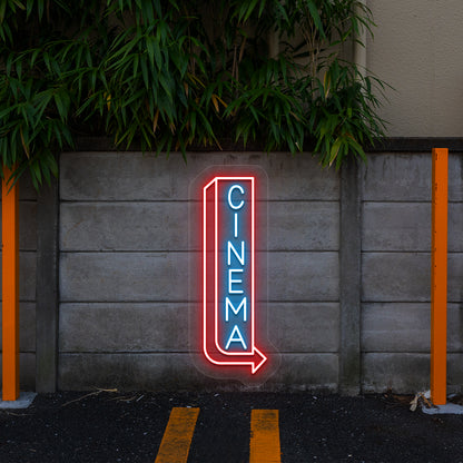 ice blue and red midnight cinema vintage neon sign mounted on a wall