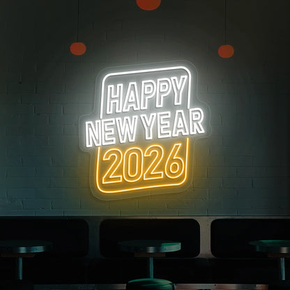 Neon sign reading Happy New Year 2026 in white and orange lights on a brick wall