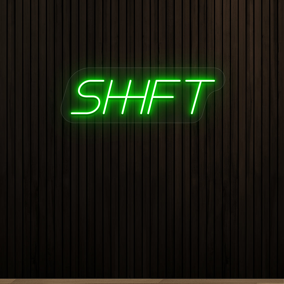 green shift vintage neon sign mounted on a wall