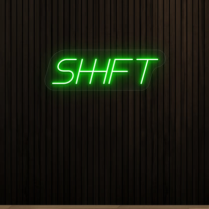 green shift vintage neon sign mounted on a wall