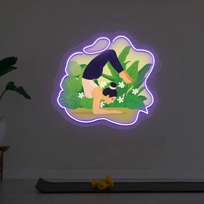 Vrischikasana Garden Yoga Neon Artwork lighting up in purple color in a yoga room
