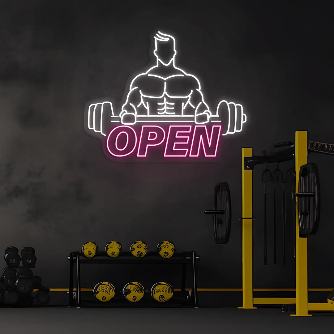 pink and white open gym bodybuilder neon sign mounted on a wall