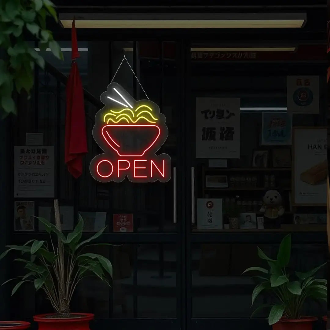 red noodles open neon sign hanging on a window