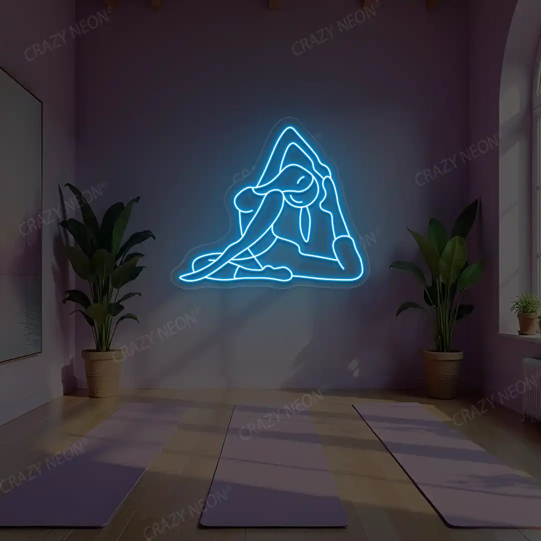 Eka Pada Rajakapotasana Yoga Neon Sign lighting up in ice blue color in a yoga room