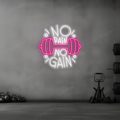 pink and white barbell motivation neon sign mounted on a wall