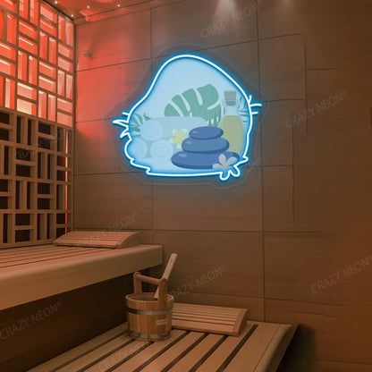 Spa Stones & Serenity Neon Artwork lighting up in ice blue color on a wooden wall