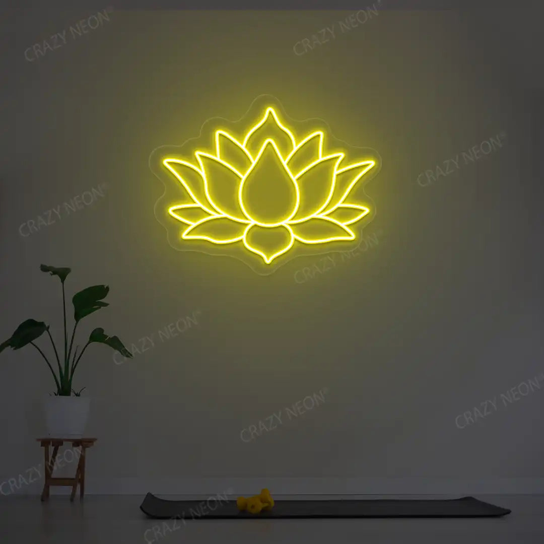 Lotus Flower Neon Sign lighting up in yellow color in a yoga room
